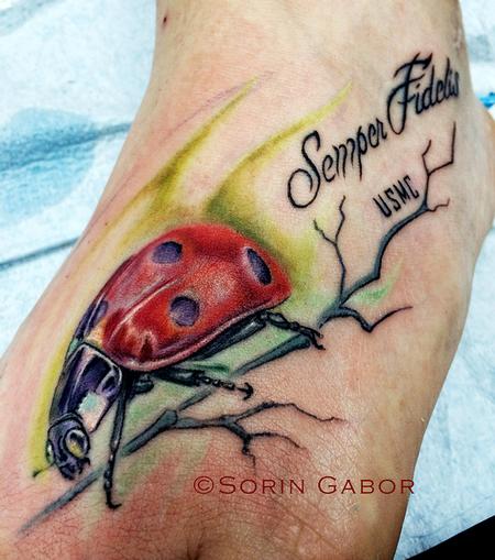 Sorin Gabor - Realistic color ladybug foot tattoo